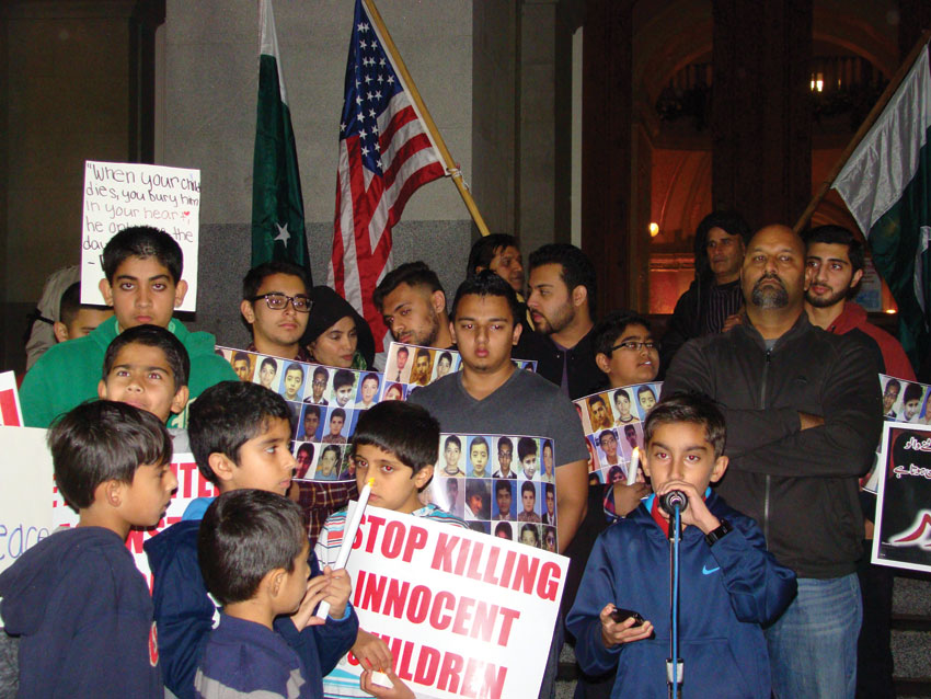 Children addressing the vigil to protest the terror attacks in an Army school in Pakistan, in Sacramento, Dec. 20.