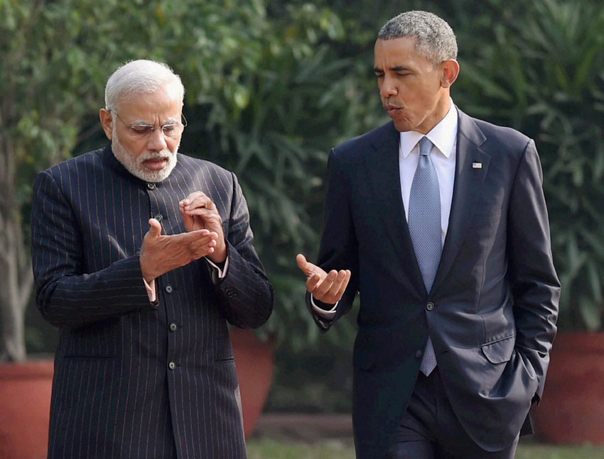 Prime Minister Narendra Modi and U.S. President Barack Obama chat on key issues as they stroll in the gardens of Hyderabad House in New Delhi, Jan. 25. (Atul Yadav | PTI)