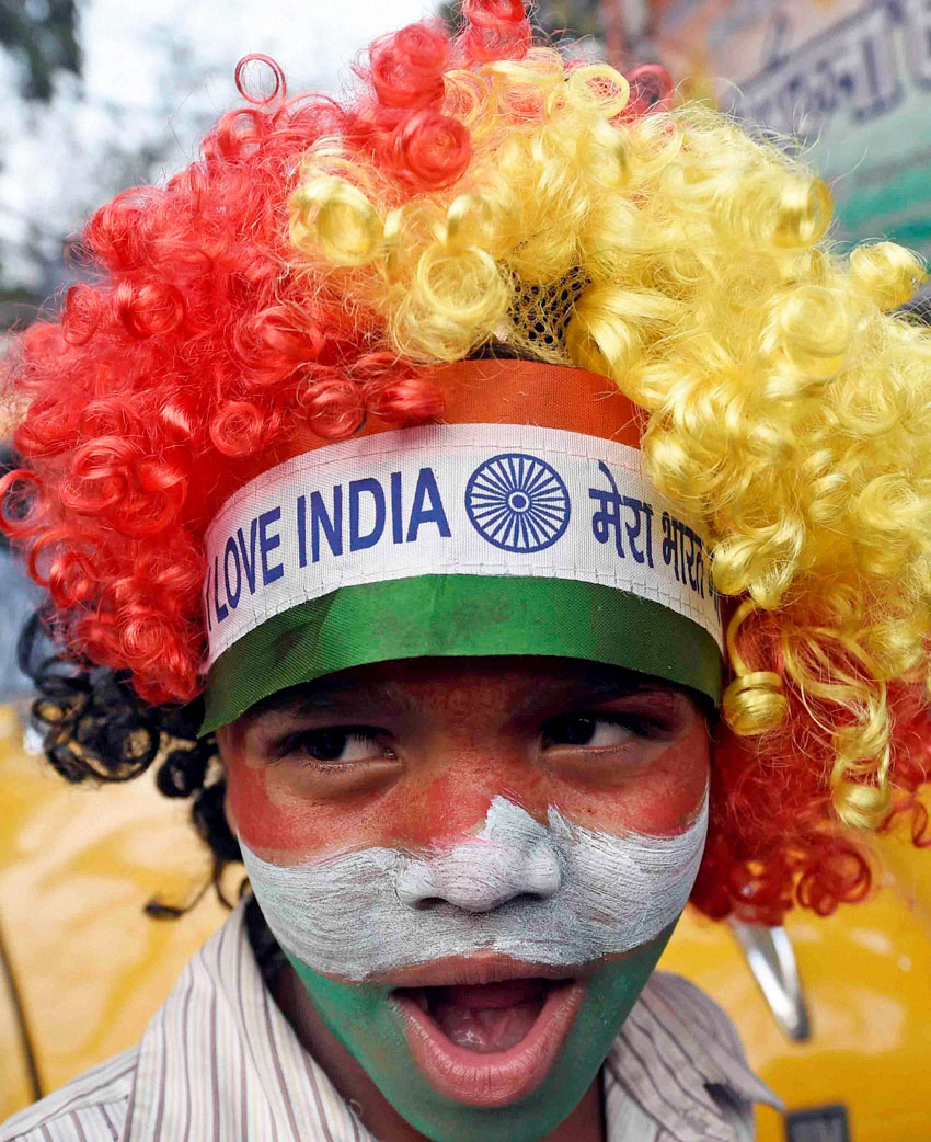 A cricket fan celebrates India's victory against South Africa in ICC Cricket World Cup at Kolkata, Feb. 22.   (Ashok Bhaumik | PTI)