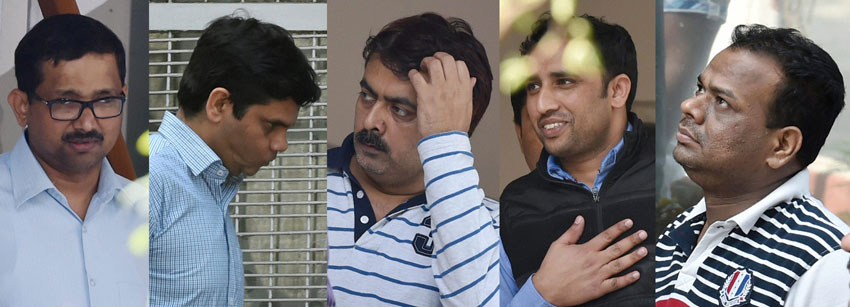 Five senior executives from top energy firms, arrested in connection with corporate espionage scandal, before they were produced in a court in New Delhi, Feb. 21. (Atul Yadav | PTI)