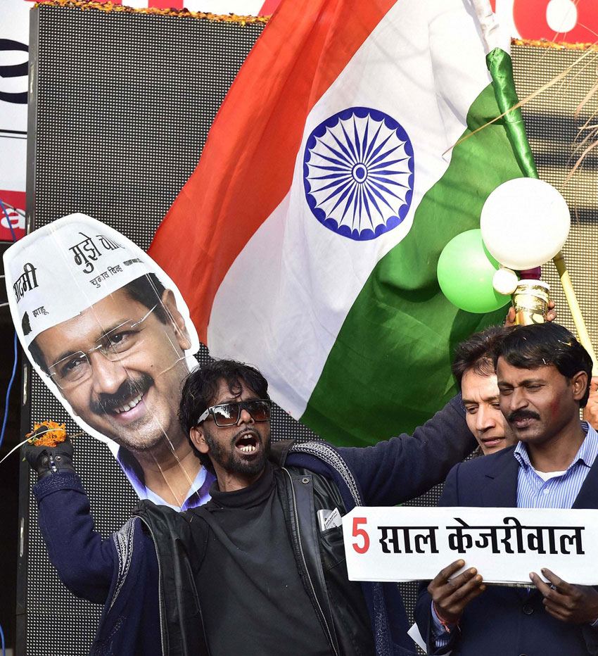 AAP supporters celebrate the party's victory in the Delhi Assembly polls, at Patel Nagar in New Delhi, Feb. 10. (Kamal Kishore | PTI)