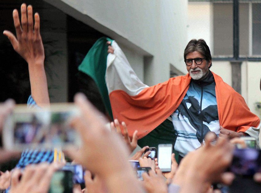 Amitabh Bachchan celebrates after India won their first match against Pakistan in ICC Cricket World Cup 2015, in Mumbai, Feb. 15. (Press Trust of India)