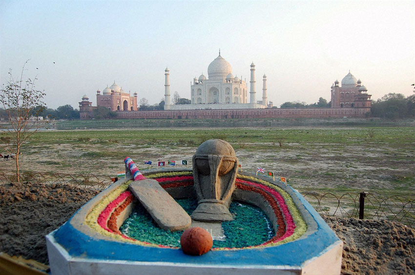 Sand artist Sudarshan Patnaik creates a sand image on ICC World Cup 2015 near the Taj Mahal in Agra, Feb. 13. (Press Trust of India)