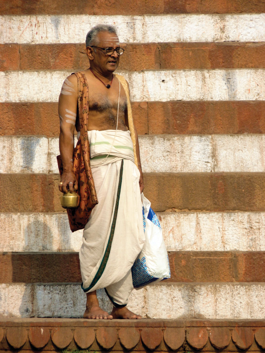 A worshipper at the banks of river Ganga in Varanasi, India.