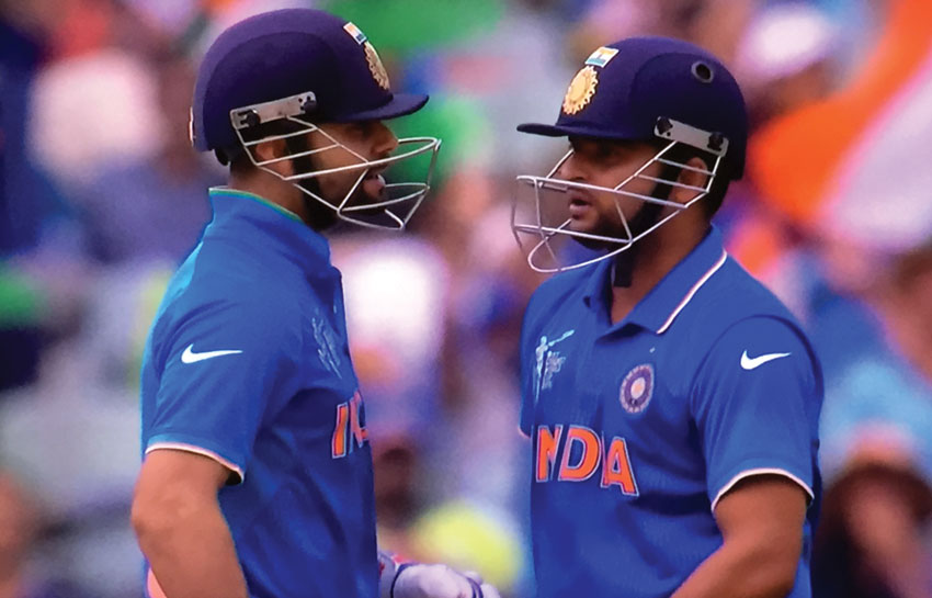 India’s Virat Kohli and Suresh Raina pause for a chat in between overs at the 2015 World Cup Cricket Pool B game against Pakistan, in Adelaide, Feb. 15.