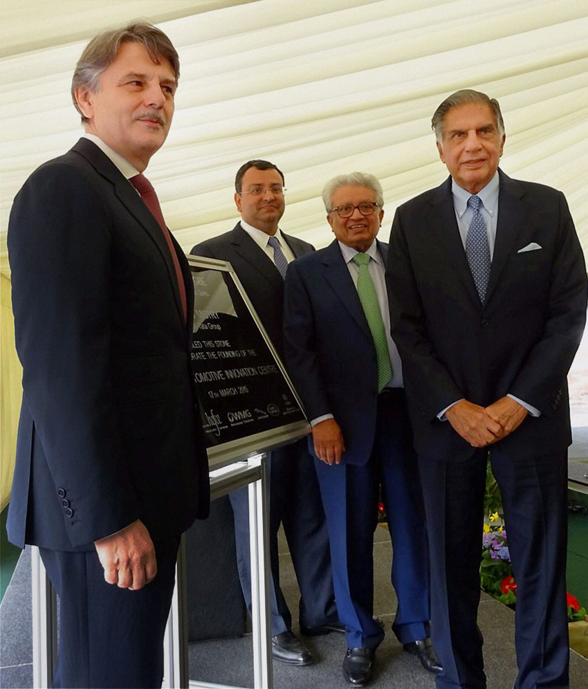 Tata Chairman Emeritus Ratan Tata (r) with Tata Group chairman Cyrus Mistry at the foundation stone laying ceremony for a new £150-million National Automative Innovation Centre at University of Warwick in Coventry, Mar. 18. Lord Kumar Bhattacharya, chairman of the Warwick Manufacturing Group, and Ralf Speth, CEO of Jaguar Land Rover are also seen. (Press Trust of India) 