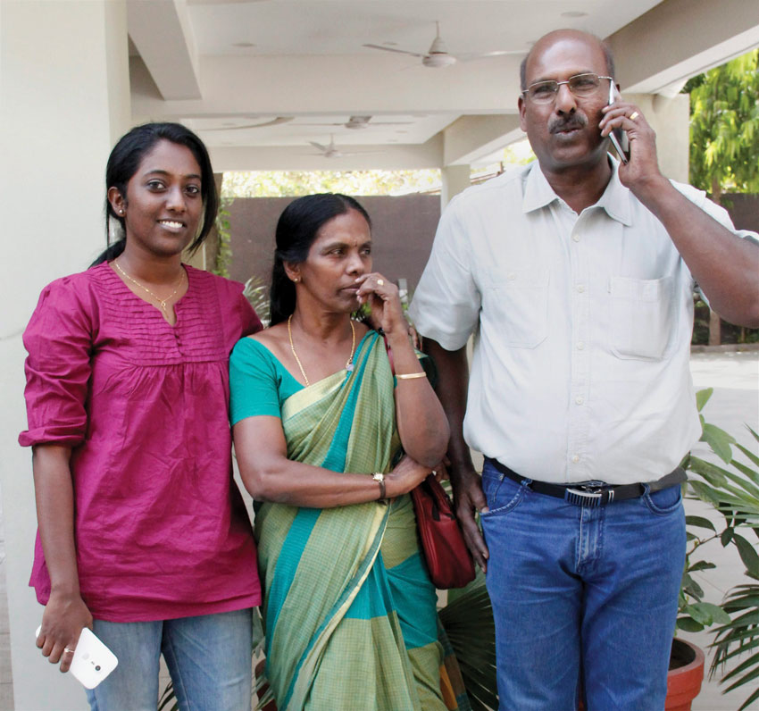 Rinu Srinivasan with her parents, who was arrested for posting comments on the social networking site against the shutdown in Mumbai following Bal Thackeray's death reacts after the Supreme Court struck down Section 66 A of the IT Act, in Ahmedabad, Mar. 24. (Press Trust of India)