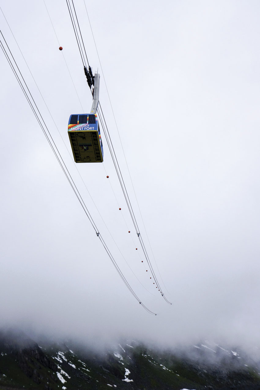 A cable car at Verbier ascends into the clouds.