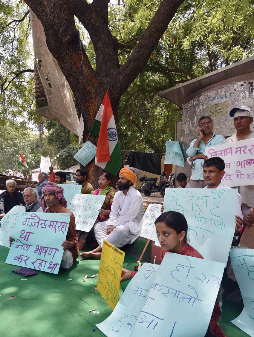 People sit on a “dharna” at Jantar Mantar over farmer Gajender Singh's suicide, in New Delhi, Apr. 23. (Kamal Singh | PTI)