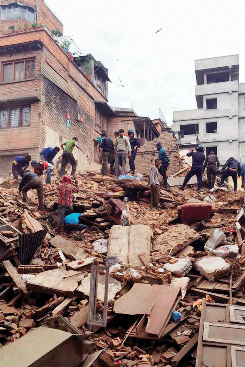 The debris of a collapsed building after a powerful earthquake in Kathmandu. (Press Trust of India)