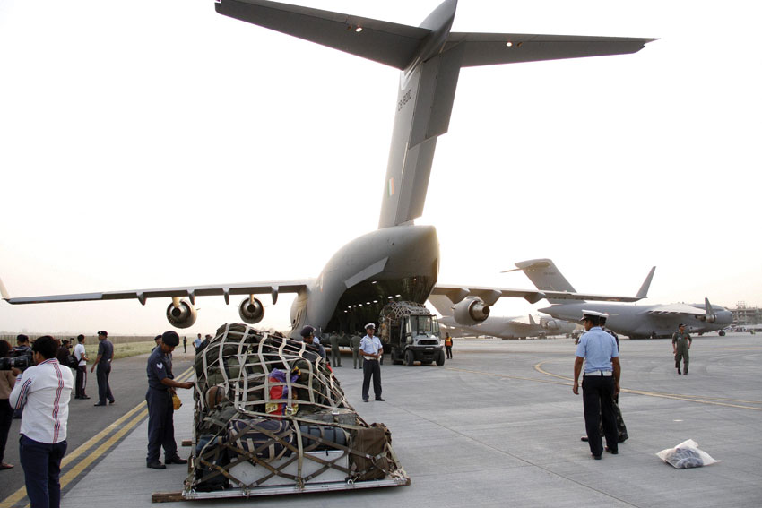 Relief materials being loaded into an Indian Air Force aircraft headed for Nepal, in New Delhi, Apr. 25. (Press Trust of India)
