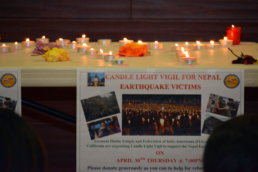 A sign and candles lit up as FIA of Northern California held a candlelight vigil and fundraiser at the Fremont Hindu Temple in support of the victims of Nepal Quake, Apr. 30. (Amar D. Gupta | Siliconeer)