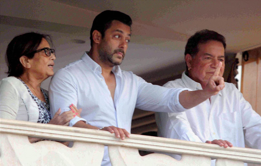 Salman Khan with father Salim Khan and mother Salma greets fans from his residence after returning from the Sessions Court in Mumbai, May 8. (Shashank Parade | PTI) 