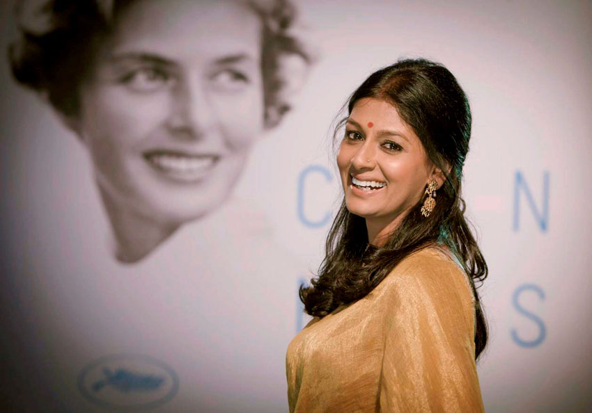 Bollywood actress Nandita Das stands next to a poster of Ingrid Bergman at Cannes Film Festival, May 13. The poster was chosen this year to pay tribute to Bergman for her contribution to film. (Press Trust of India)