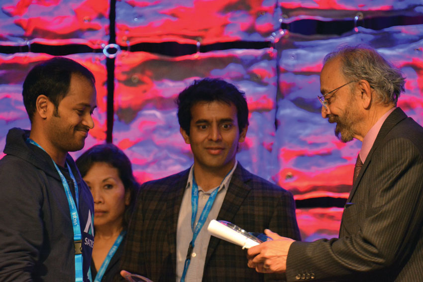 Serial entrepreneur and venture capitalist Suhas Patil (r) awarding one of the #TiE50 winners at #TiEcon 2015. Amar D. Gupta | Siliconeer