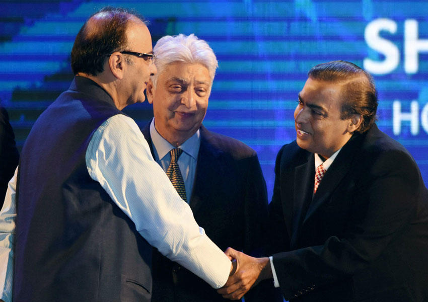 Finance Minister Arun Jaitley shakes hands with Reliance Industries chairman Mukesh Ambani as Wipro Chairman Azim Premji looks on at the launch of Digital India Week in New Delhi, July 1. (Manvender Vashist | PTI)