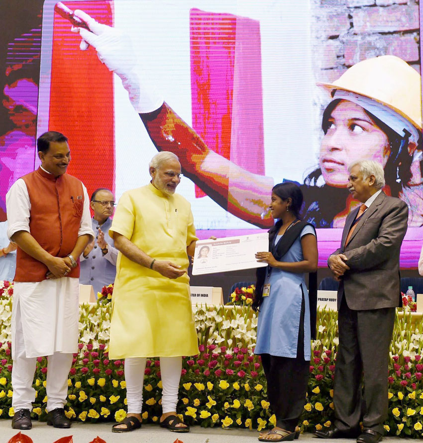 Prime Minister Narendra Modi awarding the certificate to a successful trainee under Pradhan Mantri Kaushal Vikas Yojna, at the launch of Skill India Campaign in New Delhi, July 15. (Subhav Shukla | PTI) 