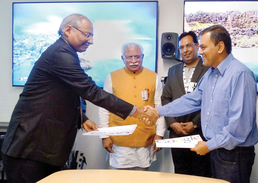Haryana Principal Secretary Industries Devender Singh and a representative of Google after signing a MoU in the presence of Chief Minister Manohar Lal Khattar and Industries Minister Capt. Abhimanyu in San Francisco, Aug. 21. (Press Trust of India) 