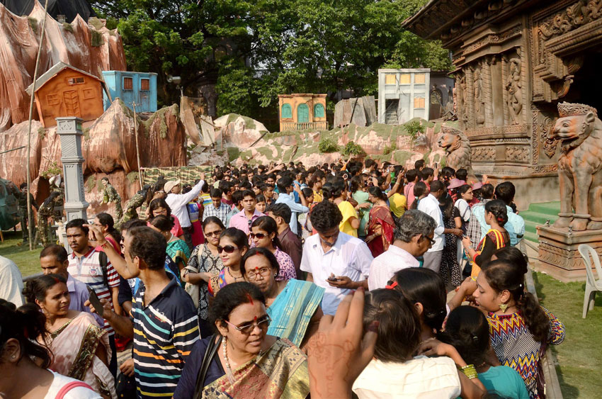 People visiting Durga Puja pandal themed as "Nepal earthquake and rescue by Indian Army," in Kolkata, Oct. 19. (Press Trust of India) 