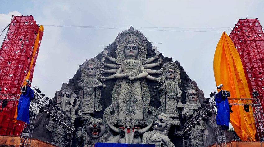 Tallest idol of Goddess Durga made of fiber glass gets ready for worship at Deshapriya Park Sarbojanin, in Kolkata, Oct. 16. (Press Trust of India) 