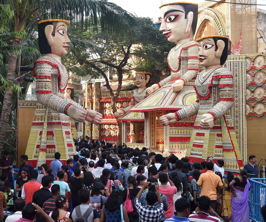 People visiting a community Durga Puja pandal in Kolkata, Oct. 19. (Swapan Mahapatra | PTI) 