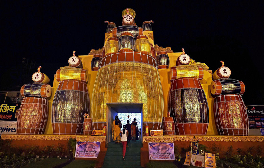A community Durga Puja pandal built with drums in Kolkata, Oct. 20. (Swapan Mahapatra | PTI) 
