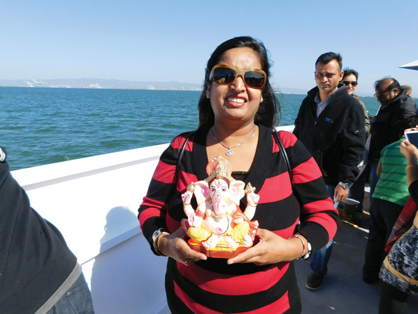 Siliconeer co-publisher Seema Gupta holds a small Ganesh idol in San Francisco. (Vansh A. Gupta | Siliconeer) 