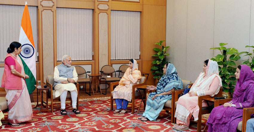 Geeta and Edhi Foundation members during their meeting with Prime Minister Narendra Modi after her return to India, in New Delhi, Oct. 26. Minister for External Affairs and Overseas Indian Affairs, Sushma Swaraj is also seen. (Press Trust of India) 