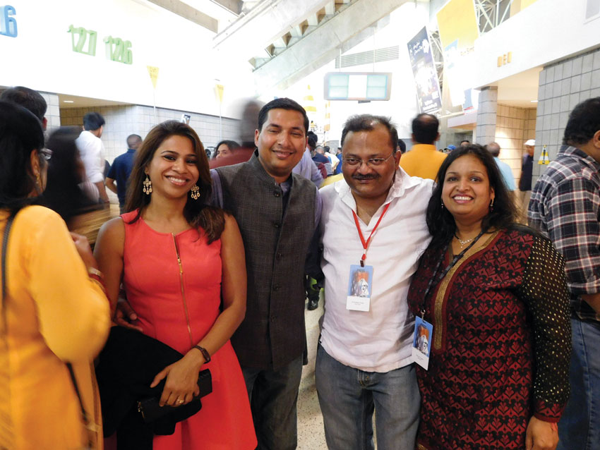 (R-l): Siliconeer co-publisher Seema Gupta, Siliconeer editor Amar D. Gupta, Kislay Banka and Sonal Banka in a festive mood, ready to greet Prime Minister Modi at the SAP Center, Sept. 27. (Vansh A. Gupta | Siliconeer) 