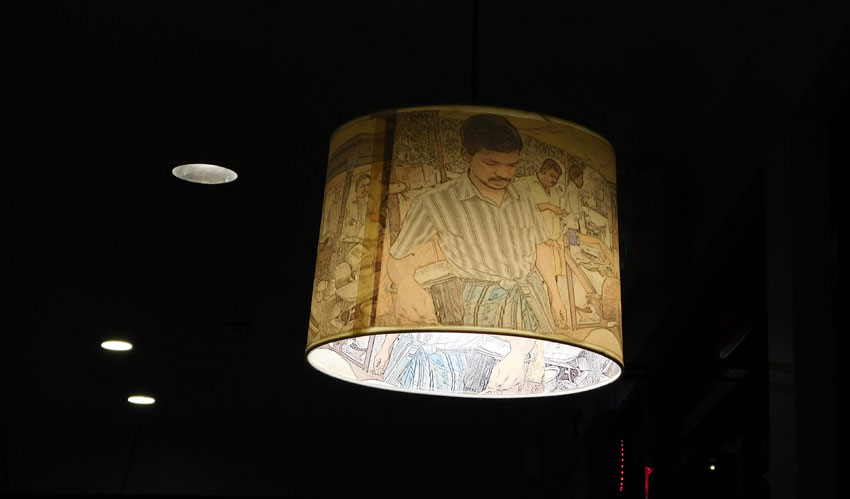 Lamp shade with pictures of a South Indian kitchen. 