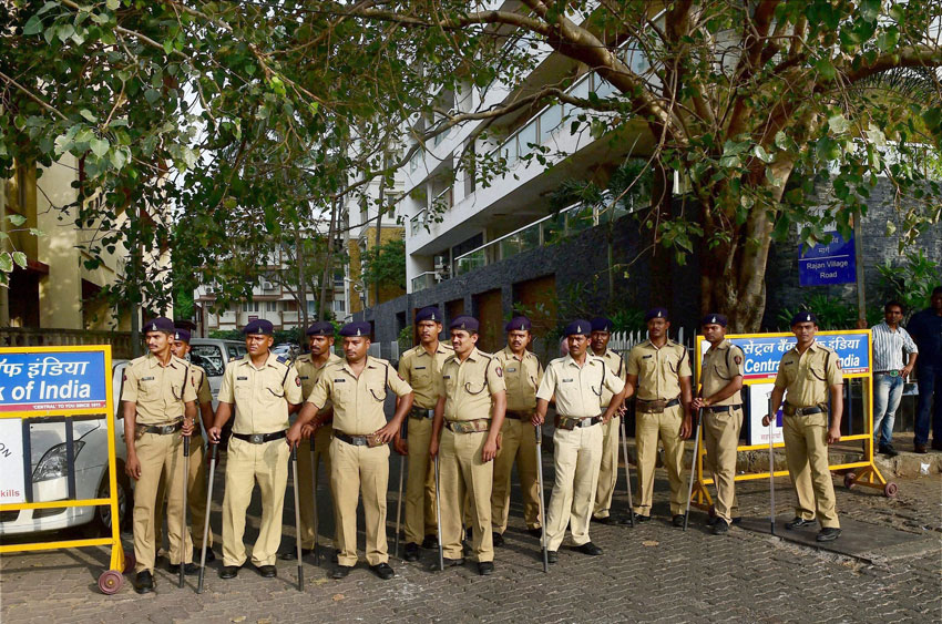 Police stand guard outside the residence of Aamir Khan following his comment on growing intolerance in India, in Mumbai, Nov. 24. (Mitesh Bhuvad | PTI) 