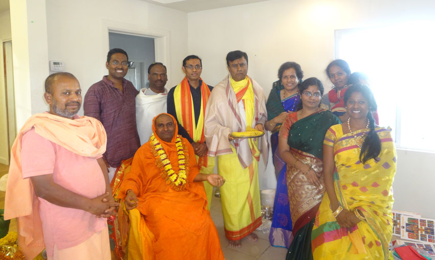 Swamiji with event organizers. 