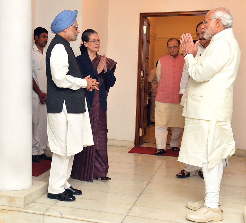 Prime Minister Narendra Modi meets the former Prime Minister, Dr. Manmohan Singh, and Congress President Sonia Gandhi, in New Delhi, Nov. 27. (Press Information Bureau)