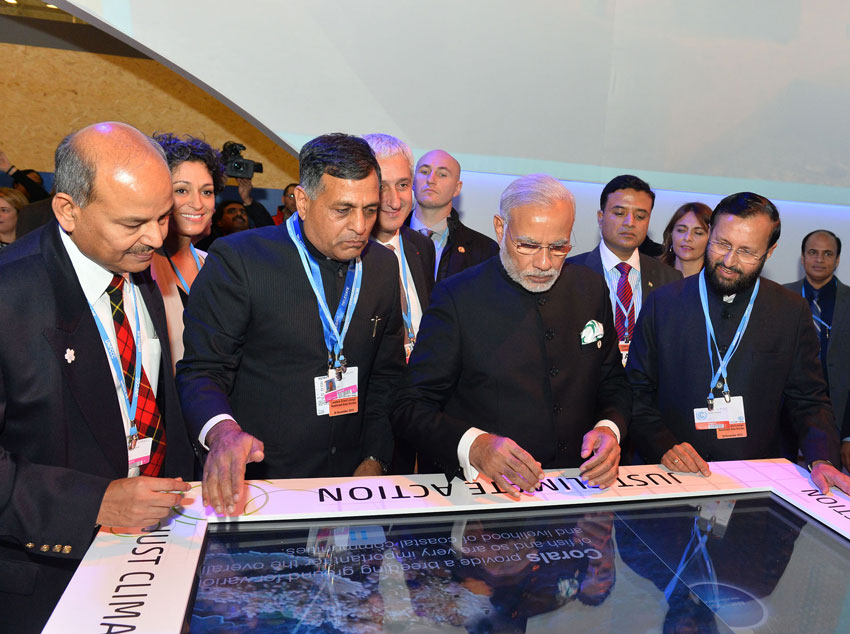 Prime Minister Narendra Modi visiting the India Pavilion, at COP21 Summit, in Paris, Nov. 30. Minister of State for Environment, Forest and Climate Change (Independent Charge), Prakash Javadekar, and the Secretary, Ministry of Environment, Forest and Climate Change, Ashok Lavasa, are also seen. (Press Information Bureau) 