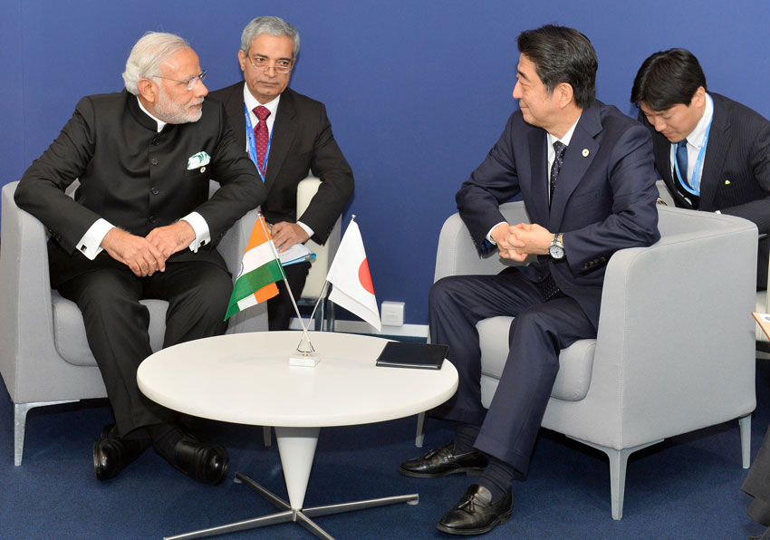 Prime Minister Narendra Modi meeting Japanese Prime Minister Shinzo Abe, on the sidelines of COP21 Summit, in Paris, Nov. 30. (Press Information Bureau) 