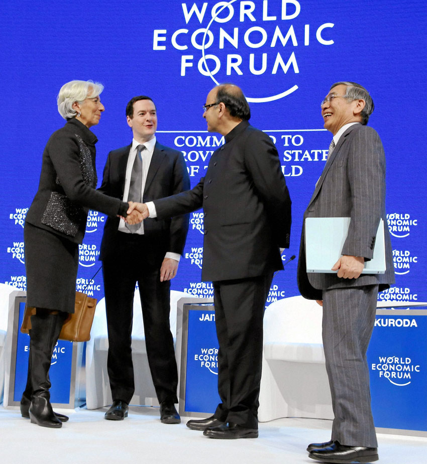Indian Finance Minister Arun Jaitley shakes hands with Christine Lagarde, managing director, International Monetary Fund, at a session at the World Economic Forum in Davos, Switzerland, Jan. 23. (Press Trust of India) 