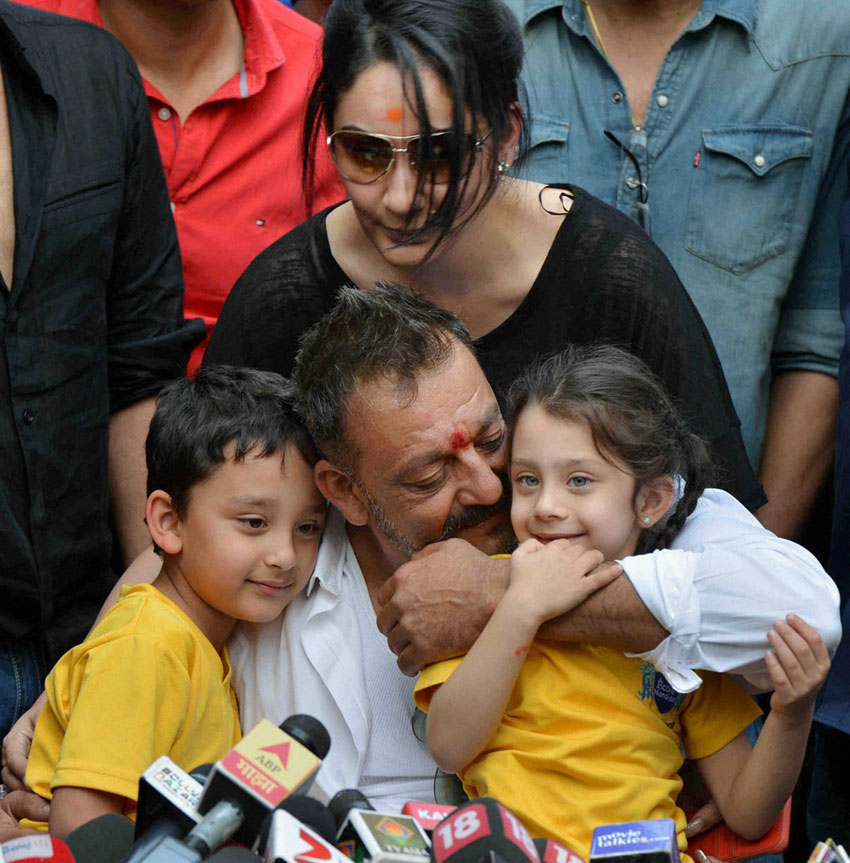 Sanjay Dutt, with his wife Manyata, and children Shahran and Iqra, during a press conference at his residence in Mumbai, Feb. 25. Dutt walked free, Feb. 25, after completing his five-year prison sentence for illegal weapons possession in a case linked to the 1993 serial bomb blasts. (Press Trust of India) 