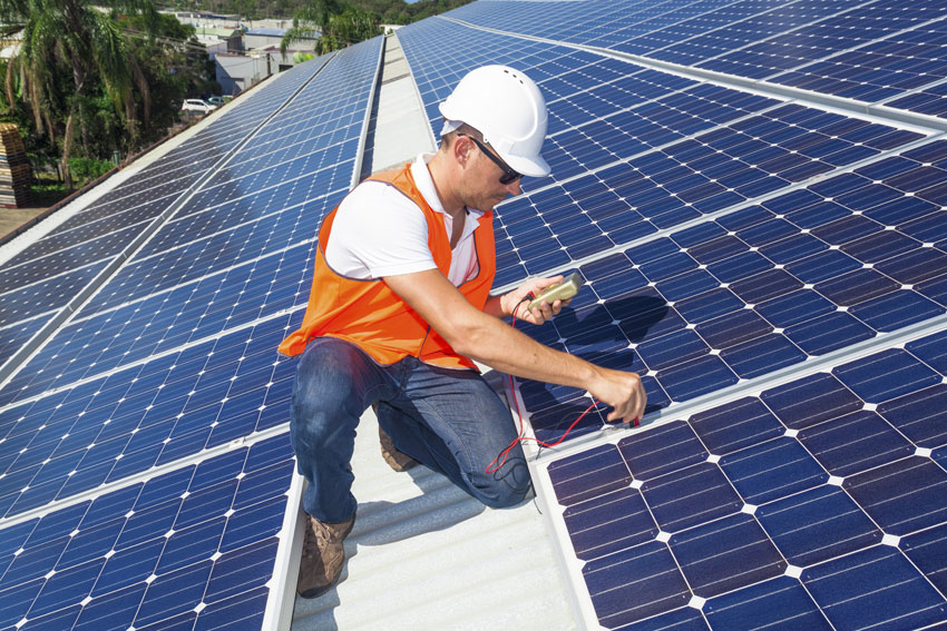 A U.S. technician working with solar panels. 