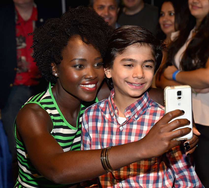 File photo of Lupita Nyong'o (l) and Neel Sethi of “The Jungle Book” as they take part in "Worlds, Galaxies, and Universes: Live Action at The Walt Disney Studios" presentation at Disney's D23 EXPO 2015, Aug. 15, in Anaheim, Calif.  (Alberto E. Rodriguez | Getty Images) 