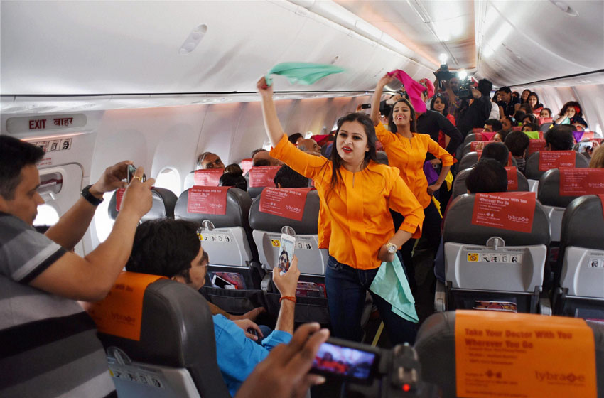 Inflight crew on board a SpiceJet Delhi-Goa flight perform a Holi dance post boarding before take off in New Delhi, Mar. 22. (Shirish Shete | PTI) 