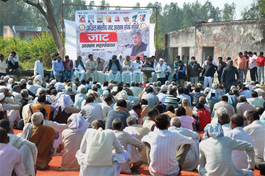 Jat community members holding a meeting for reservations, in Amroha, U.P, Feb. 23. (Press Trust of India) 