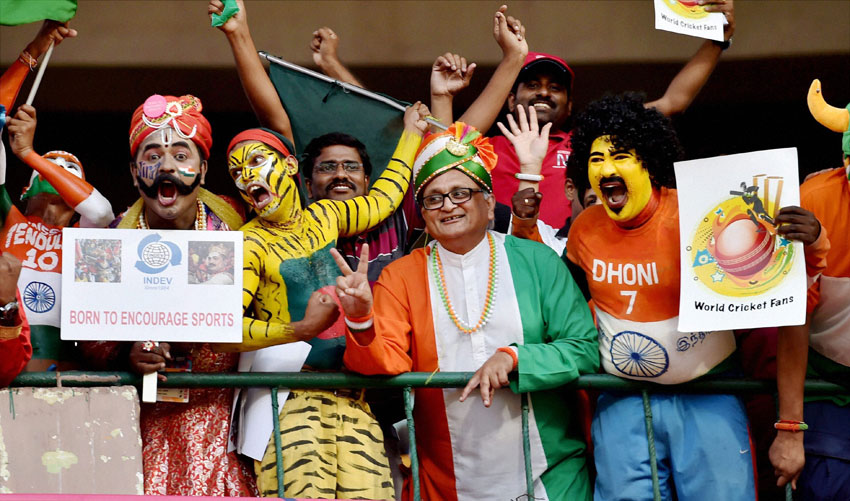Indian fans cheer up before the start of the World T20 match between India and Bangladesh at Chinnaswamy Stadium in Bengaluru, Mar. 23. (Shailendra Bhojak | PTI) 