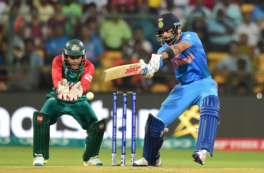 India's Virat Kohli plays a shot during the World T20 match against Bangladesh at Chinnaswamy Stadium in Bengaluru, Mar. 23. (Shailendra Bhojak | PTI) 