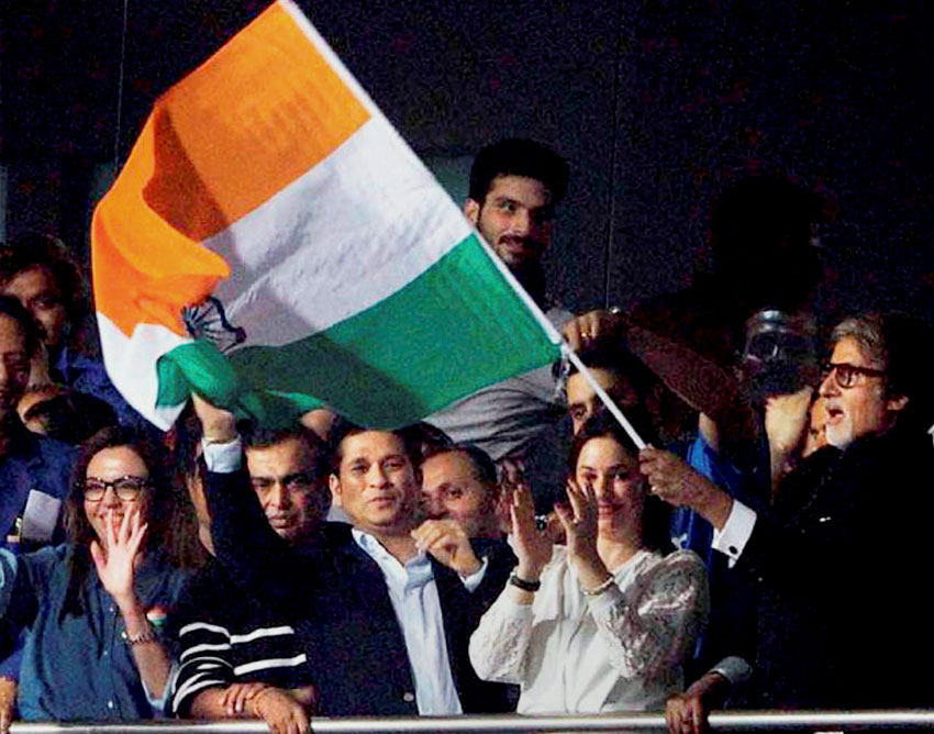 Amitabh Bachchan (r), Sachin Tendulkar with his wife Anjali, industrialist Mukesh Ambani and his wife Nita Ambani and others celebrate India’s victory over Pakistan at Eden Gardens in Kolkata, Mar. 19. (Press Trust of India) 