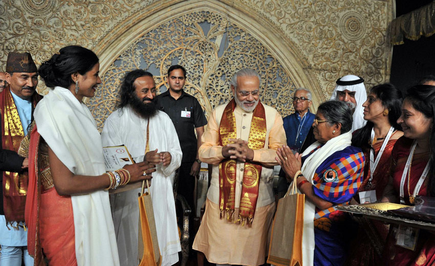 Prime Minister Narendra Modi with Art of Living founder Sri Sri Ravishankar during the opening day of the three-day long World Culture Festival on the banks of Yamuna River in New Delhi, Mar. 11. (Press Trust of India)