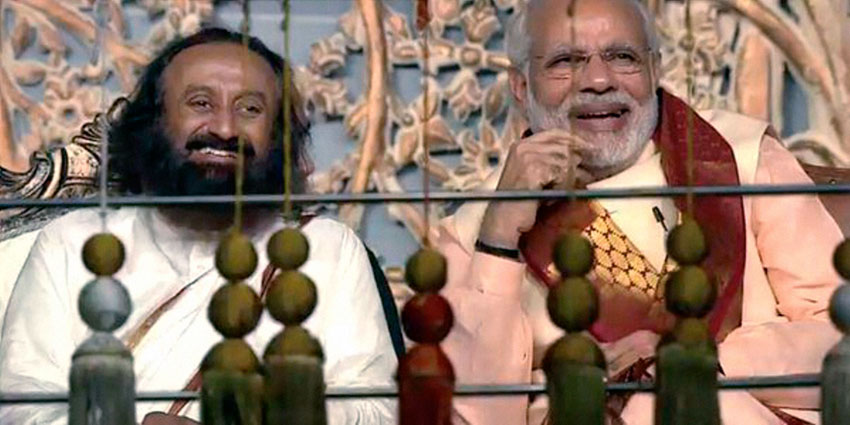 Prime Minister Narendra Modi with Art of Living founder Sri Sri Ravishankar during the opening day of the three-day long World Culture Festival on the banks of Yamuna River in New Delhi, Mar. 11. (Press Trust of India) 