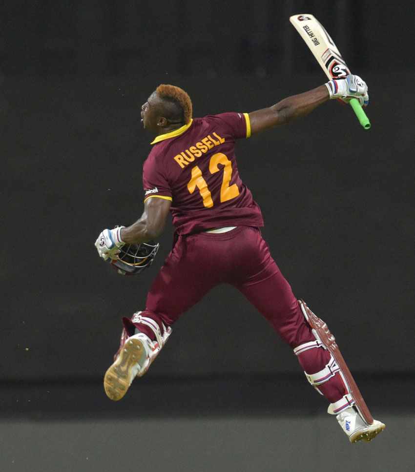 West Indies player Russell celebrates win against India during the ICC WT20 world cup semi final match at Wankhede Stadium in Mumbai, Mar. 31. (Santosh Hirlekar | PTI) 