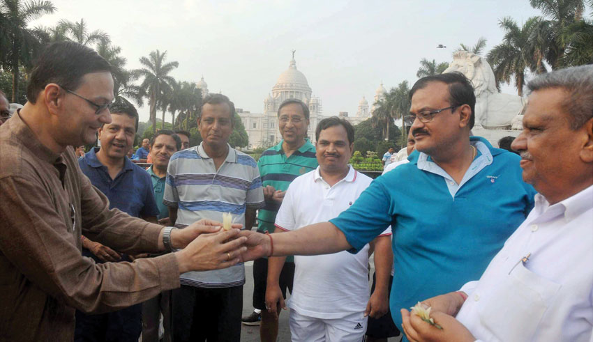 Netaji Subhash Chandra Bose's grand nephew and BJP candidate from Bhawanipore constituency Chandra Bose interacts with morning-walkers during his Assembly election campaign in Kolkata, Mar. 30. (Press Trust of India) 