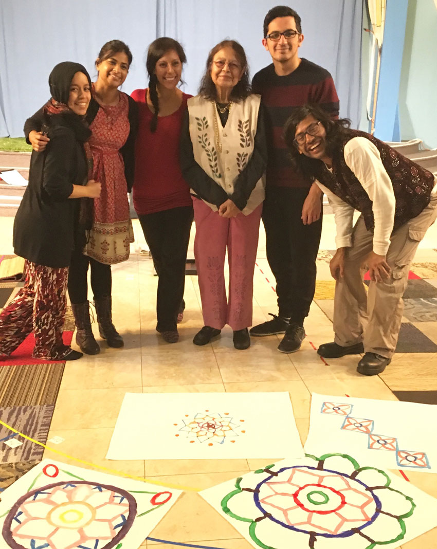 Mitali Perkins’ mother, Madhusree Bose, in vest, surrounded by cast members, after teaching them how to paint ‘alpanas.’ 