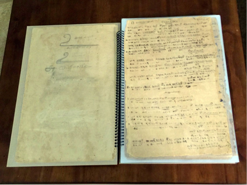 Restored 70-year old music notebook of the author’s mom, made from stained poor quality paper during Word-War II, a vintage, antique possession. 